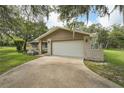 Spacious two-car garage and driveway offer ample parking space for residents and guests at 10614 Hudson Ave, Hudson, FL 34669