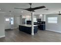 Spacious open-concept kitchen featuring a large island, stainless steel appliances, and ample natural light at 11110 1St E St, Treasure Island, FL 33706