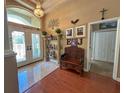 Elegant foyer showcasing tile flooring, a chandelier, and decorative furnishings at 13807 Eagles Rock Ct, Hudson, FL 34667