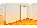 Spacious bedroom with wood floors, closet, and a decorative ceiling light fixture at 1907 Fluorshire Dr, Brandon, FL 33511