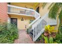 View of a condo exterior, showcasing a well-maintained building and verdant foliage at 2424 W Tampa Bay Blvd # G204, Tampa, FL 33607