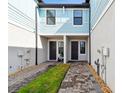 Charming townhome entrance with a paved walkway and well-maintained landscaping at 2432 Golden Pasture Cir, Clearwater, FL 33764