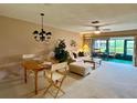 Cozy living room with dining area featuring neutral tones and lots of natural light at 2541 Laurelwood Dr # 8C, Clearwater, FL 33763