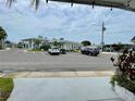 Community clubhouse featuring ample parking, pristine landscaping, and inviting common areas at 34091 Alamanda N Dr, Pinellas Park, FL 33781