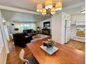 Open concept dining area showcasing an eat-in kitchen and a connected living space at 34091 Alamanda N Dr, Pinellas Park, FL 33781