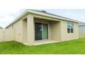 Covered back patio with a ceiling fan, offering a comfortable outdoor living space at 3762 Mossy Limb Ct, Palmetto, FL 34221