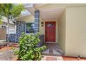 Close-up of the front door and porch showing the stone columns and brick walkway at 5611 Burlington N Ave, St Petersburg, FL 33710