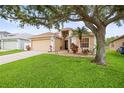 Charming single-Gathering home with lush green lawn and mature landscaping at 826 Addison Ne Dr, St Petersburg, FL 33716