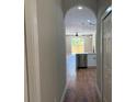 Hallway that looks into a modern kitchen and living space at 904 Grand Canyon Dr, Valrico, FL 33594