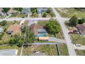 Aerial view of a property with a screened pool, a shed, and fenced yard within property lines at 9642 Elgin Blvd, Spring Hill, FL 34606