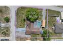 Aerial view of the property showcasing its .40-acre lot with a pool and surrounding landscape at 9642 Elgin Blvd, Spring Hill, FL 34606