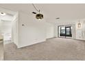 Open-concept living area leads to the screened lanai at 1206 10Th Se Cir, Largo, FL 33771