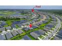 Stunning aerial view of a residential area with community pool and scenic ponds surrounding the beautiful homes at 5415 Limelight Dr, Apollo Beach, FL 33572