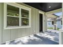 Close-up of the front porch showcases the home's entrance and architectural details at 5707 N 20Th St, Tampa, FL 33610