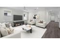 A stylish living room features contemporary furniture, a modern TV, and sleek decor at 5707 N 20Th St, Tampa, FL 33610