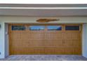 Close up of paneled garage door with decorative hardware at 735 123Rd Ave, Treasure Island, FL 33706