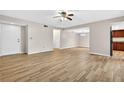 Bright, open living space with wood-look tile flooring, neutral walls, and ample closet space at 7821 Niagara Ave # 2102, Tampa, FL 33617