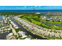 Stunning aerial view of the waterfront community, highlighting water access and proximity to the beach at 978 Signet Dr, Apollo Beach, FL 33572