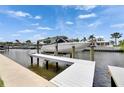 This image showcases a private boat lift on a canal, perfect for boating enthusiasts at 978 Signet Dr, Apollo Beach, FL 33572