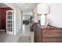 Inviting entryway with tile flooring, decorative console table, and stylish decor at 1655 Blue Rose Dr, Ruskin, FL 33570