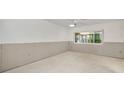 Unfinished basement room with clean concrete floors, natural light, and ready for renovation at 1660 Cape Ann Ne Ave # 2, St Petersburg, FL 33702