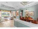 Open-concept living space with tile flooring, elegant decor, and natural light at 17921 Arbor Haven Dr, Tampa, FL 33647
