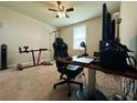 Bedroom setup as office space with a ceiling fan and a window with blinds at 219 Lovely Ct, Plant City, FL 33566