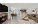 Cozy living room features a fireplace, dining area, and modern kitchen with a breakfast bar at 2400 Feather Sound Dr # 528, Clearwater, FL 33762