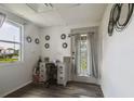 Bright entryway with a desk area, stylish decor, and a decorative door for a welcoming first impression at 2607 N 59Th St, Tampa, FL 33619