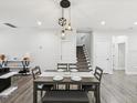 Dining area featuring modern light fixtures and adjacent staircase at 2809 N 21St St, Tampa, FL 33605