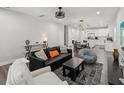 Open-concept living room with modern decor, hardwood floors, and abundant natural light at 2809 N 21St St, Tampa, FL 33605