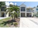 Inviting multi-level home with large windows, gated entry, and lush lawn at 3412 W San Juan St # A, Tampa, FL 33629
