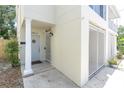 Close up of entrance featuring a classic column, locked gate, and uniquely designed circular window at 3412 W San Juan St # A, Tampa, FL 33629