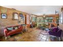 Inviting living room with terracotta flooring, eclectic decor, and comfortable seating for relaxing and entertaining at 5643 86Th N Ave, Pinellas Park, FL 33782