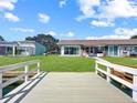 Inviting backyard view from the deck, offering a tranquil waterfront scene and direct water access at 599 Westwinds Dr # 9, Palm Harbor, FL 34683