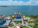 Stunning aerial view showcasing the waterfront property, pool, and surrounding landscape at 6372 Palma Del Mar S Blvd # 601, St Petersburg, FL 33715