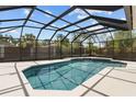 A stunning screened-in pool with a clean design and ample space for relaxing and entertaining outdoors at 6921 8Th Street E Ct, Sarasota, FL 34243