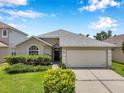Charming single-story home with a well-manicured lawn and attached two-car garage at 899 Addison Ne Dr, St Petersburg, FL 33716