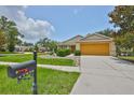 Inviting single-story home with a well-kept lawn and convenient mailbox by the sidewalk at 11415 Bright Star Ln, Riverview, FL 33569