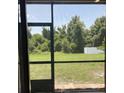 Backyard featuring lush greenery and a private fenced-in yard at 11901 Castine St, New Port Richey, FL 34654