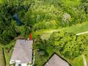 A high view displays a green golf course and lush foliage in the community at 12134 Tournament View Ave, New Port Richey, FL 34654