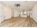 Bright and airy living room with stylish wood flooring and ample space for relaxation and entertainment at 1413 Bayshore Blvd # 11, Dunedin, FL 34698