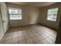 Bright room featuring tile floors and two windows, awaiting personal touches at 2354 7Th S St, St Petersburg, FL 33705