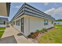 Well-maintained condo exterior showcases a private entrance, tidy landscaping, and peaceful location at 301 Kings Blvd # 130, Sun City Center, FL 33573