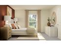 Bright bedroom with neutral tones, large window, and stylish decorative accents at 32046 Griffin Sands Ln, San Antonio, FL 33576