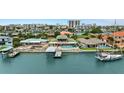Waterfront home with boat dock, swimming pool, and stunning views of the bay and city at 333 Midway Is, Clearwater Beach, FL 33767