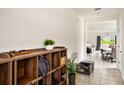 Entryway view with wood organizer and view to the open-concept living area at 3528 Maple Grove Way, Plant City, FL 33565