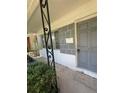 Covered front porch showcasing gray textured walls and the front door to the home at 467 34Th N Ave, St Petersburg, FL 33704