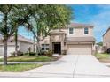 Charming two-story home with well-maintained landscaping and a two-car garage at 5916 Tulip Flower Dr, Riverview, FL 33578