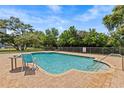Inviting community pool with lounge area surrounded by lush landscaping at 701 S Madison Ave # 505, Clearwater, FL 33756